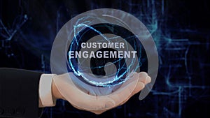 Painted hand shows concept hologram Customer engagement on his hand