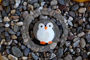 The painted hiking stone is left on the walking path for passersby to see