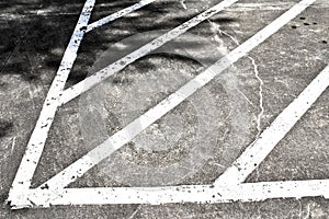 Painted lines of a loading zone in a parking lot