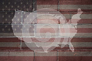 map and flag of united states of america on a old brick wall