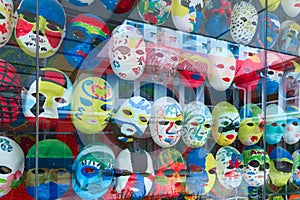 Painted masks behind glass