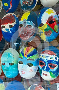 Painted masks behind glass