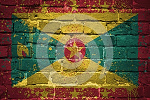 Painted national flag of grenada on a brick wall