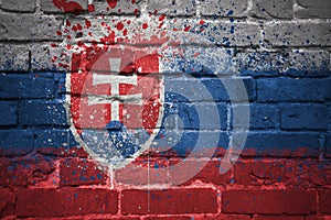 Painted national flag of slovakia on a brick wall