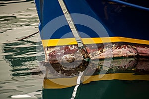 Painted old boat prow at sea