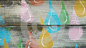 Painted raindrop design on wood