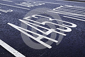 Painted road markings on Tarmac surface