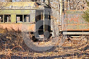 Painted rustic passenger coach cars on rails