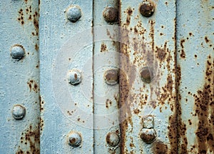 Painted rusty background with metal rivets