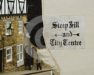 Painted Sign Directing Pedestrians to Steep Hill and the City Ce