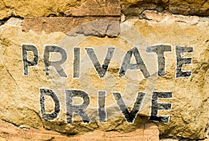 Painted stone sign saying Private Drive
