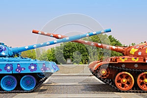 Painted tanks with crossed trunks