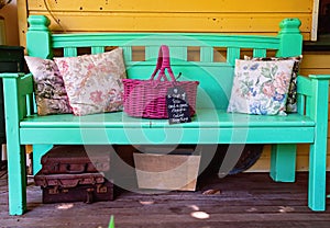 An Accoutrement Of Old Fashioned Items On A Painted Vintage Chair