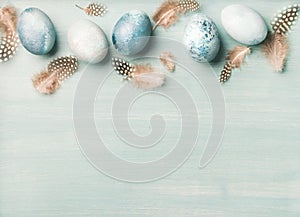Painted traditional eggs for Easter holiday over light blue background photo