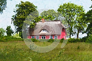 Painted traditional reed roof covered house with cottage garden on island Ruegen