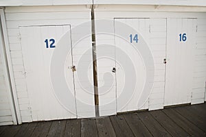 Painted white wood storage doors at boat dock