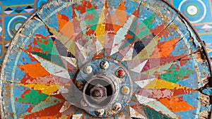 Painted wooden wheel from a traditional Costa Rican  ox cart photo