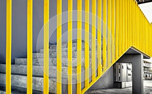 Painted Yellow Guard Rails on a Staircase