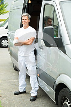 Painter With Arms Crossed In Front Of Van