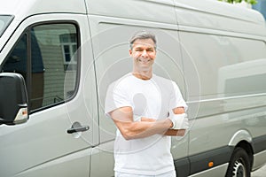 Painter With Arms Crossed In Front Of Van