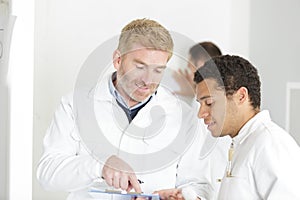 Painter and decorator with apprentices