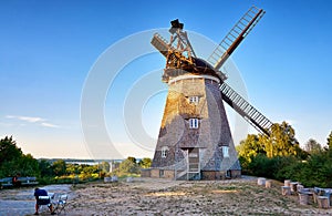 Painter at the Dutch windmill on the island of Usedom overlooking the Baltic Sea. Germany