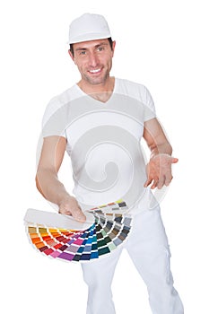Painter Holding A Paint Roller And Spectrum