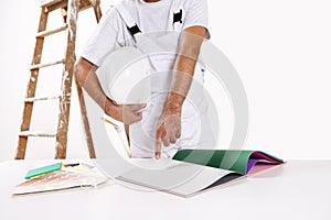 Painter man choose color from samples