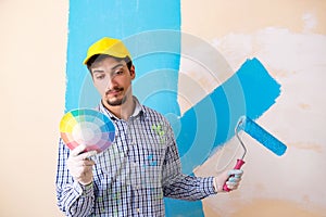 The painter man painting the wall at home