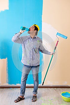 The painter man painting the wall at home