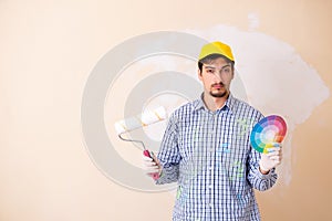 The painter man painting the wall at home