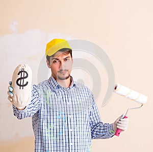 Painter man painting the wall at home