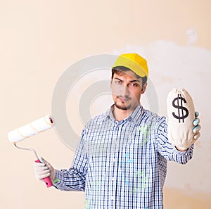 Painter man painting the wall at home