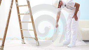 Painter man at work with brush, wall painting concept, white background