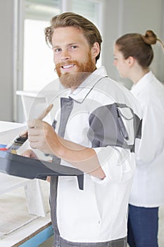 painter men mixing paint at work