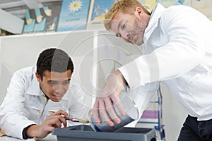 painter men mixing paint at work