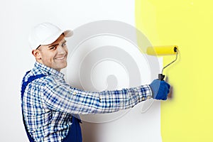 Painter painting a wall