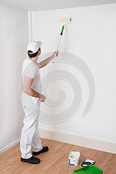 Painter Painting On Wall