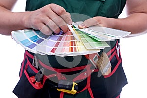 Painter`s hands with colour swatch close up