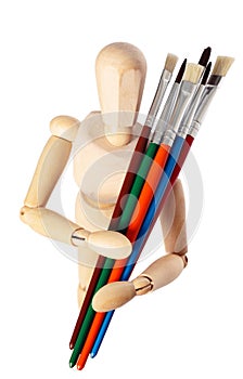 Painter's wooden model with paintbrushes