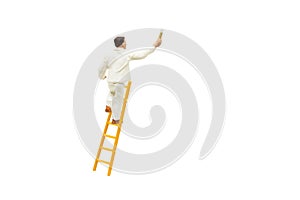 Painter standing on wooden ladder and painting wall with paint tools isolated on white background.
