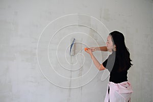 Painter On Stepladder Painting Wall With Brush