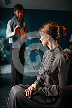 Painter work with female poseur in art studio