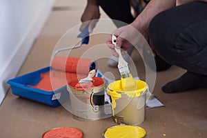 Painters prepare color for painting