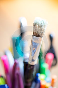 Painting artwork: paint brushes on creative background