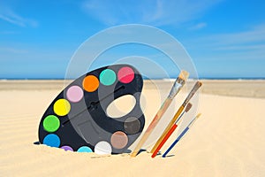 Painting brushes at the beach