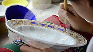 Painting ceramic benjarong is traditional thai five basic colors style pottery