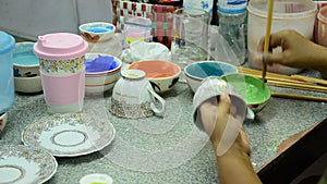 Painting ceramic benjarong is traditional thai five basic colors style pottery