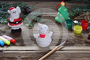 Painting Christmas toys from porcelain for decorations. Making clay toy with your own hands. Children's DIY concept. Handmade