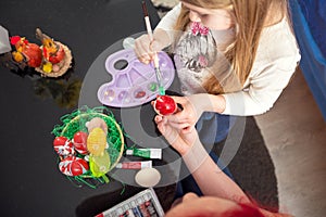 Painting colorful eggs, Happy Easter